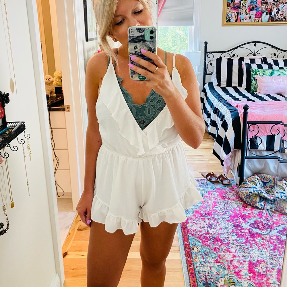 Adorable white romper with ruffle details